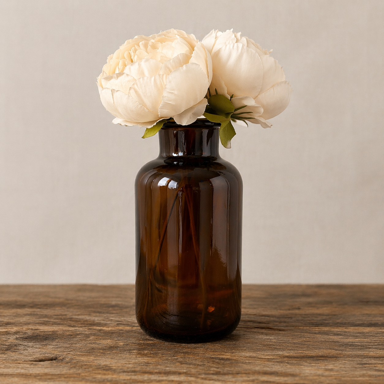 Collected Amber Glass Bottle with Floral Arrangement